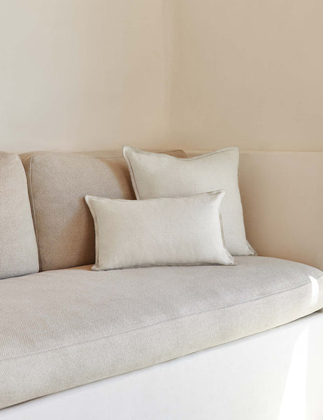 #color::ivory #style::square #fill type::with-feather-down-insert #fill type::pillow-cover-only | The arlo Ivory flax linen pillow in its lumber and square sizes sit together on a natural linen sofa