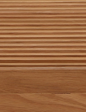 Close up of the Olson mid-century slatted wood bench in natural oak.