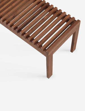 Corner of the Olson mid-century slatted wood bench in walnut.