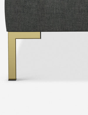 The golden leg on the Deva Charcoal Linen platform bed