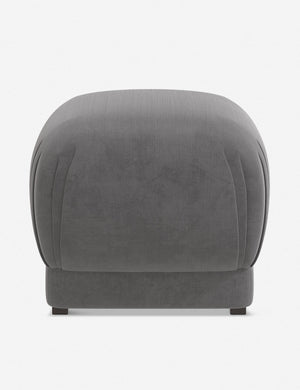 Bailee Steel Velvet upholstered ottoman with a pouf-like design and pleated corners