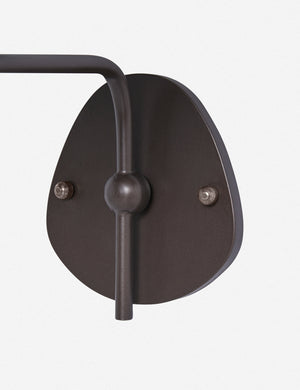 Close up of the wall mount of the Magdalene black single sconce