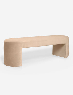 Angled view of the Mikhail light pink velvet foam-padded bench.