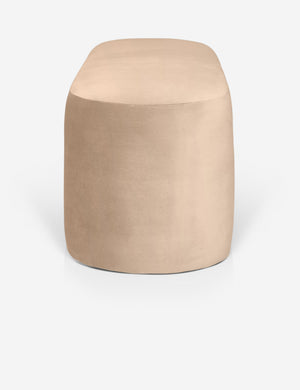 Side view of the Mikhail light pink velvet foam-padded bench.