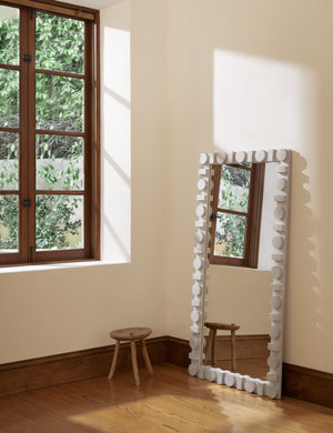 Sorenson Floor Mirror in bleached ash leaning against a wall.