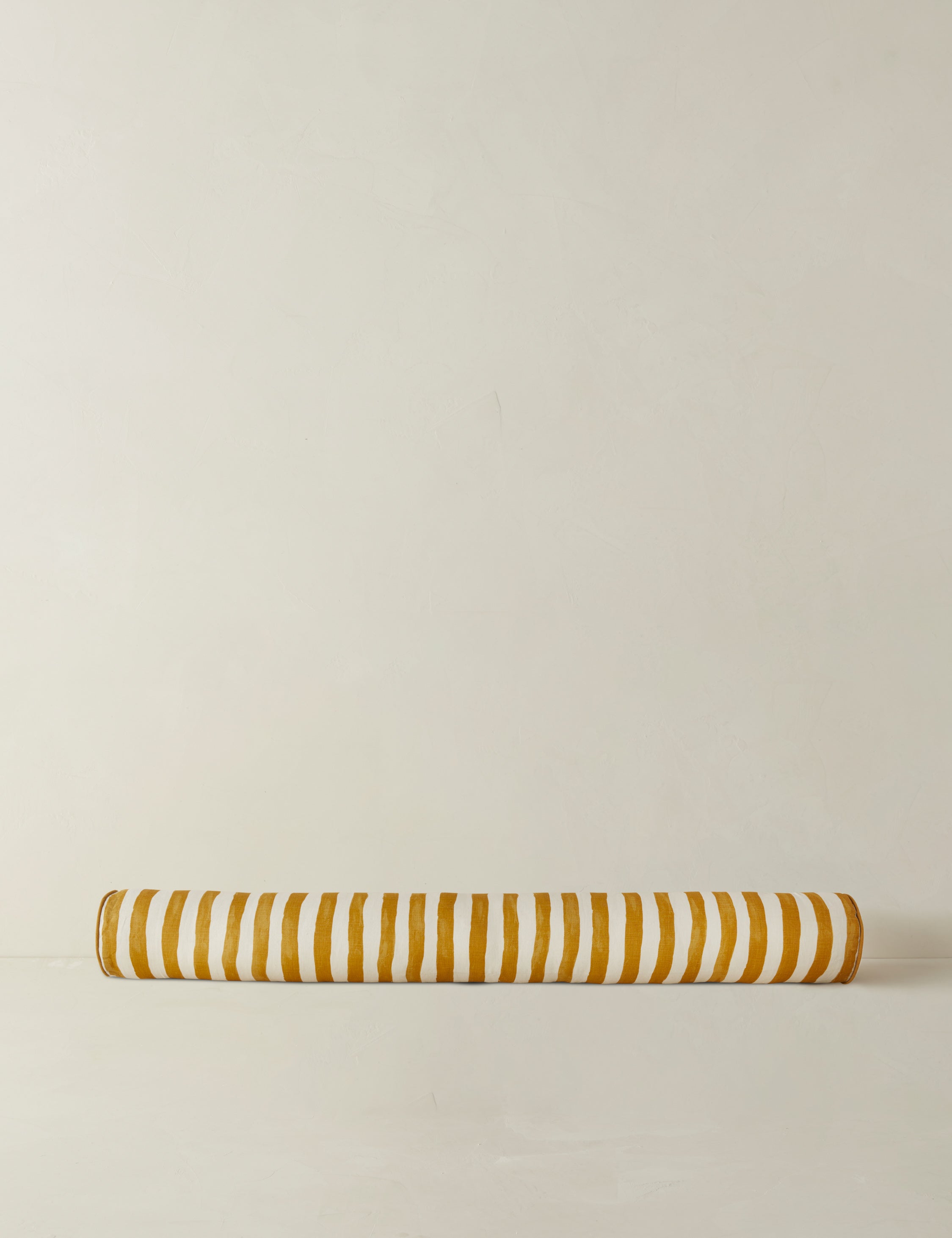 #color::goldenrod-and-ivory | Painterly stripe linen long bolster throw pillow in goldenrod and ivory