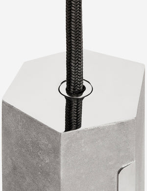 Close-up of the sand casted stainless steel hardware on the Basalt slender hexagonal single pendant light by tala