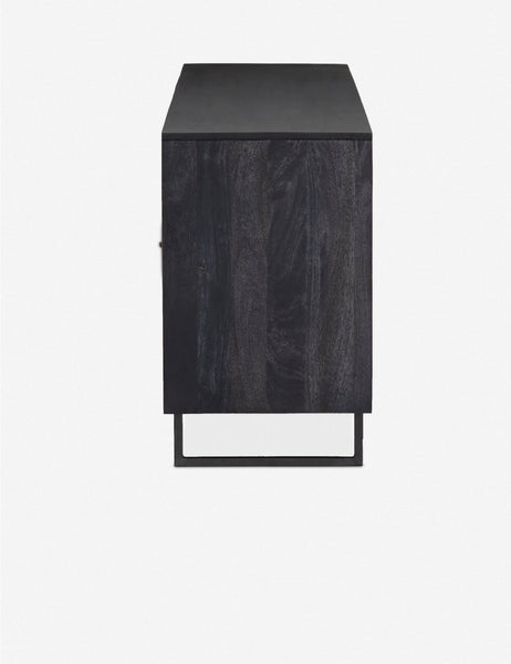 #color::black-and-natural | Side view of the Hannah black mango wood sideboard with cane doors and an iron base.