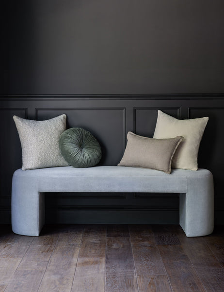 #color::oyster #style::square  #fill type::with-feather-down-insert  #fill type::pillow-cover-only |   Charlotte oyster white square velvet pillow sits on an ice blue velvet bench with other throw pillows