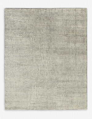 Uma black and natural checkered grid pattern rug